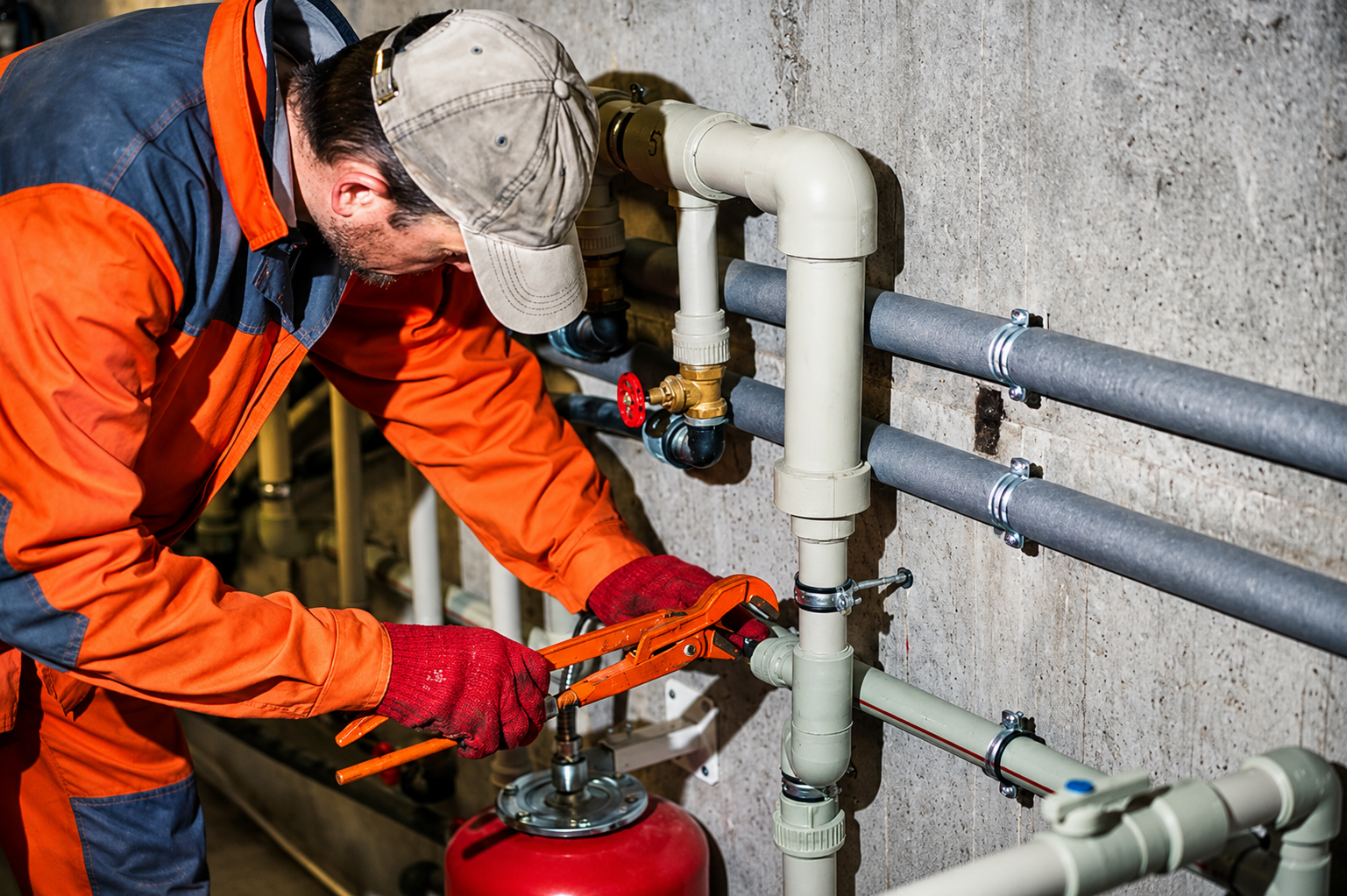 Plumbing technician servicing equipment